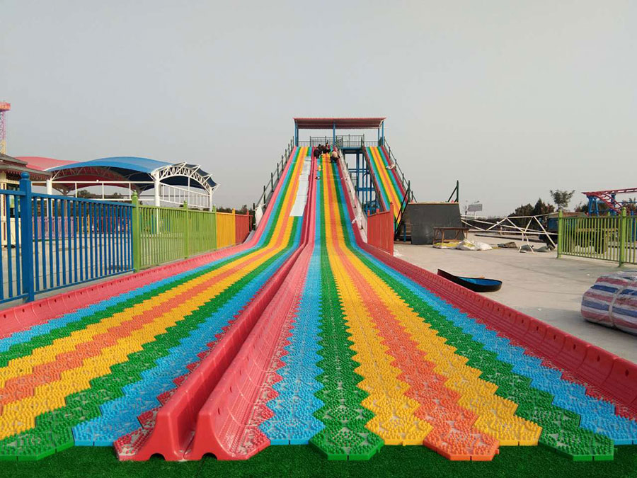 Which parts are included in the price of the rainbow slide